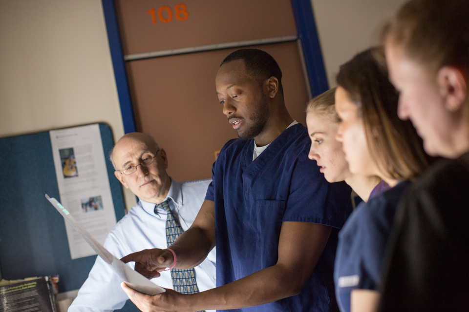 Group of students examining an x-ray