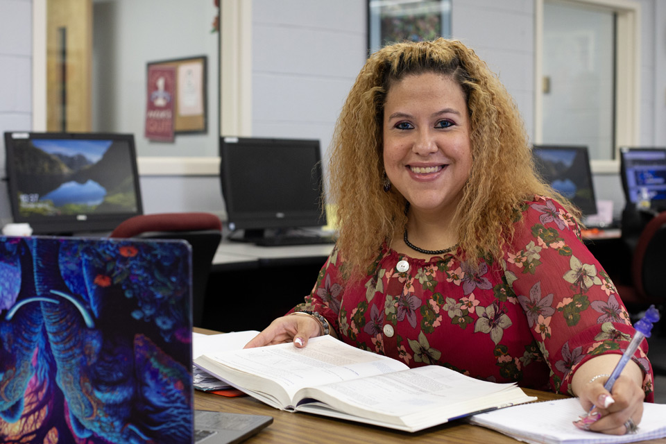 Adult female student sitting at a laptop computer