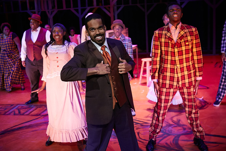 Scene - Man at center stage singing