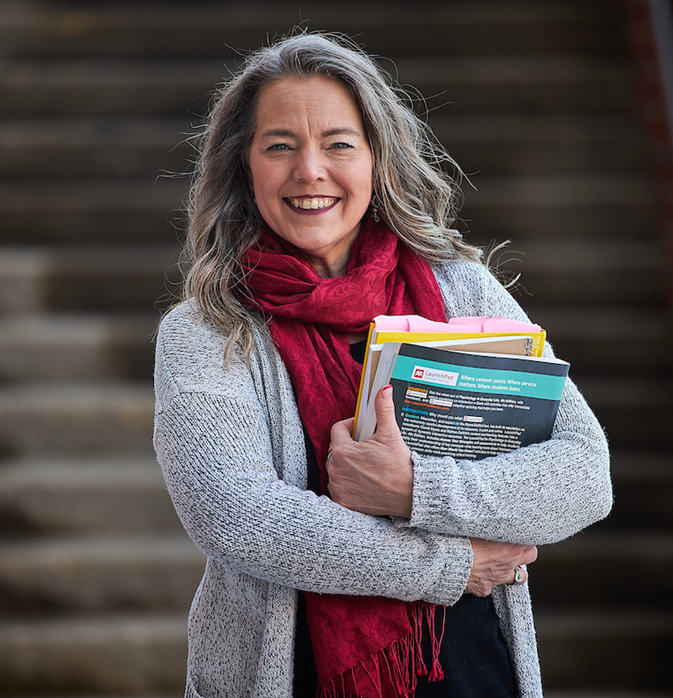 Kim Kindred holding her books